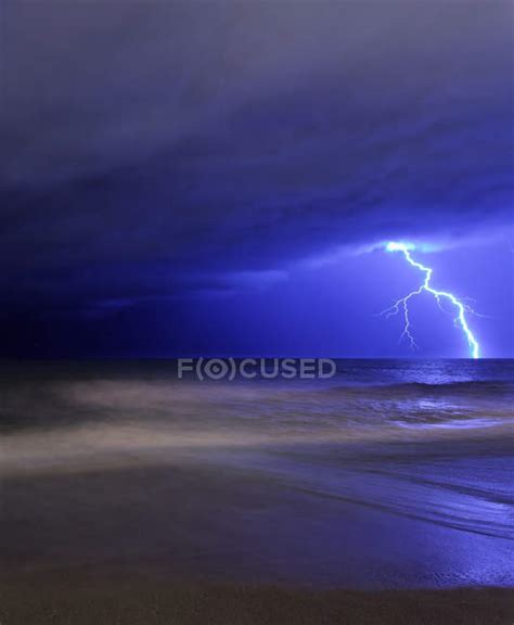 Bolt Of Lightning From Approaching Storm At Beach In Miramar Argentina