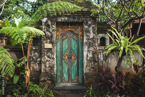 Naklejka Traditional Balinese Handmade Carved Wooden Door Bali Style