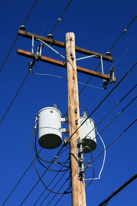 A utility pole is a column or post used to support overhead power lines and various other public utilities, such as electrical cable, fiber optic cable, and related equipment such as transformers and street lights. Power Pole With Transformers Free Stock Photo - Public ...