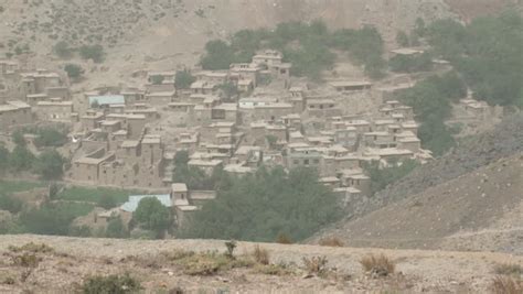 A Small Rural Village Nested In The Arid Mountains Of The