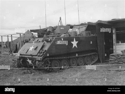 A Photograph Of An M113 Armored Personnel Carrier It Is Backed Up To