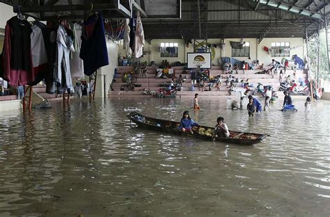 Philippine Typhoons Kill 59 Floods Trap Hundreds