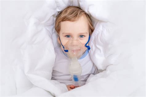Premium Photo Sick Baby Boy With Inhaler Treats Throat At Home The