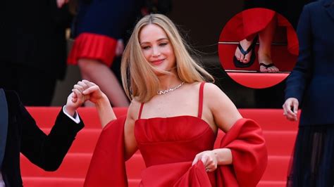 Jennifer Lawrence Wears Comfy Flip Flops With Red Dior Gown At Cannes