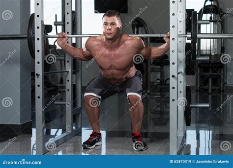 Young Man Doing Exercise Barbell Squat Stock Image Image Of Building