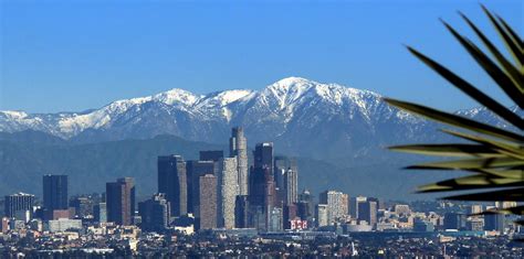 Los Angeles Skyline And Snowy Mountains Photograph By Jeff