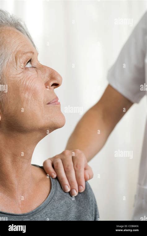 Senior Woman Comforted By Adult Hi Res Stock Photography And Images Alamy