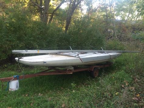Scow — a scow, in the original sense, is a flat bottomed boat with a blunt bow, often used to haul garbage or similar bulk freight; 1982 Melges C-Scow sailboat for sale in Minnesota