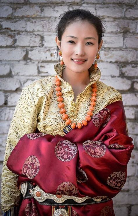 Tibetan Woman In Traditional Festive Costume Of Her Region With