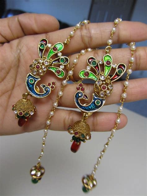 Show off some ear candy with hoops earrings, studs and statement earrings. Jhumka Jhumki ~ Jewellery India