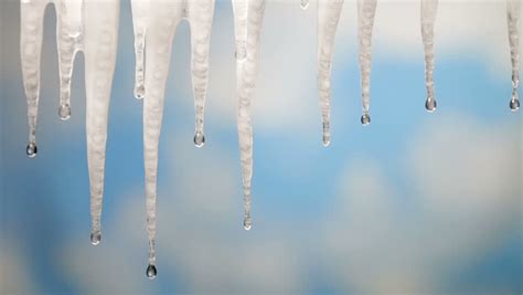 Melting Icicles Over Blue Sky Background Stock Footage Video 3608615