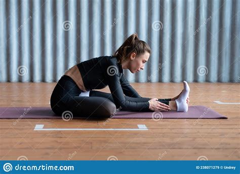 woman leans forward stretches her back and legs stock image image of fold sporty 238071279