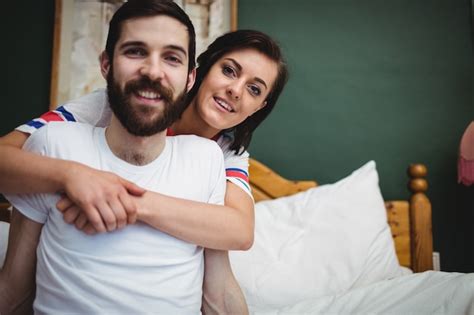 Free Photo Woman Embracing Man On Bed