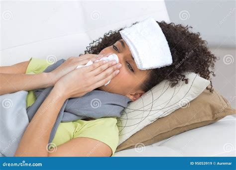 Sick Woman Blowing Nose On Sofa At Home Stock Image Image Of Rest