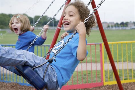 Little Children Playing On Swings Stock Image C0466857 Science