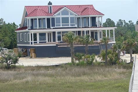 The roof is a natural brown asphalt shingle with grey and even some black added in. Red Roof House Colors | Accurate Metal Roofing Color Chart | Red roof house, Red roof, Exterior ...