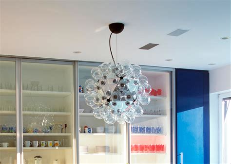 Sixty bulbs bunch tightly together around a reflective center, appearing like wispy parachutes on a dandelion. Flos Taraxacum 88 Suspension 1 - Midfurn Furniture Superstore