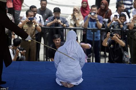 Indonesian Woman Collapses In Pain As She Is Flogged For Having Sex