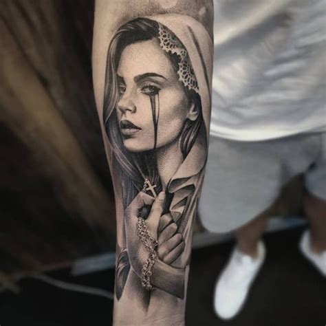 Virgin Mary Portrait Tattoo In Black And Grey On The Sleeve Made