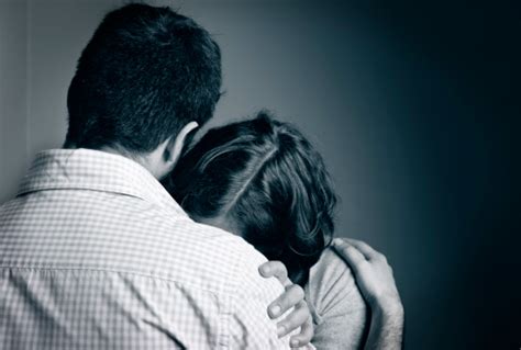 Distressed Couple Comforting Each Other A Shoulder To Cry On Stock