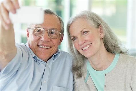 Portrait Of Senior Couple Taking Selfie On Phone Photograph By Science Photo Library Fine Art