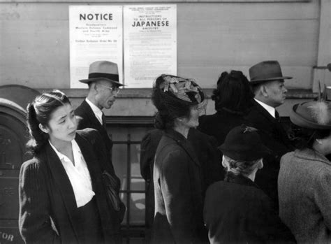 [photo] japanese americans in front of poster with internment orders california united states