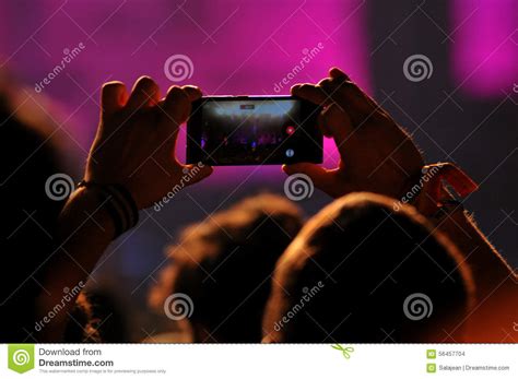 Crowd Of People Taking Photos With Smartphones At A Concert Editorial