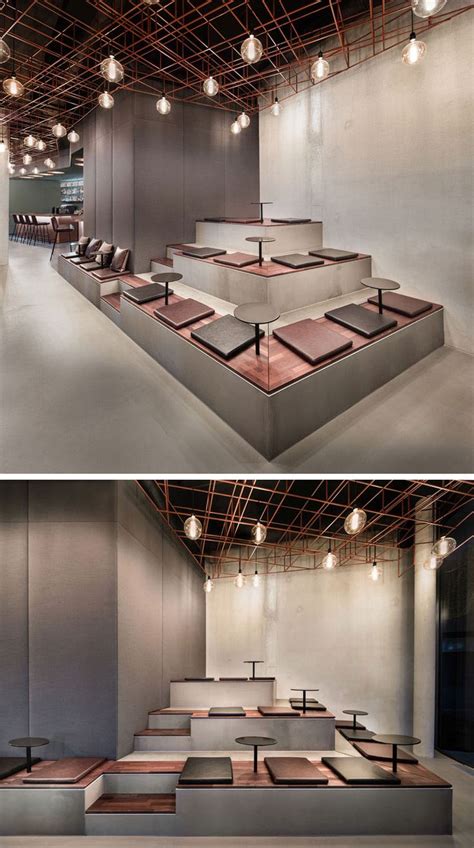 In This Modern Bar The Benches Expand Into A Tiered Seating Area With