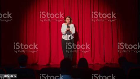 Female Director Talking To Audiences And Introducing Performance And