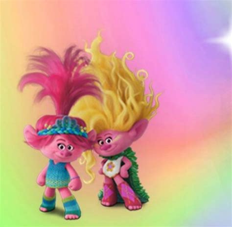 Two Cartoon Characters Standing Next To Each Other On A Rainbow Colored