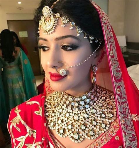 Indian Bride In Red Lehenga And Heavy Kundan Polki Jewelry Rajasthani Matha Patti In Polk