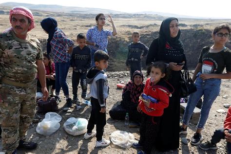 Displaced by war, Kurdish families stuck at Syria-Iraq ...