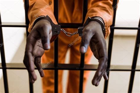 Cropped Image African American Prisoner Handcuffs Prison Bars Stock