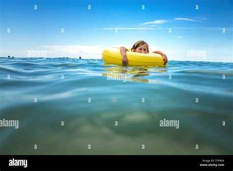 Girl Floating On Inner Tube Hi Res Stock Photography And Images Alamy