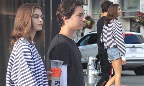 Kaia Gerber Looks Casually Chic In A Striped Sweater And Denim Cut Off