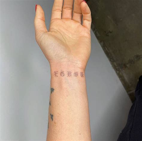 Gothic Font Lettering Tattoo On The Wrist