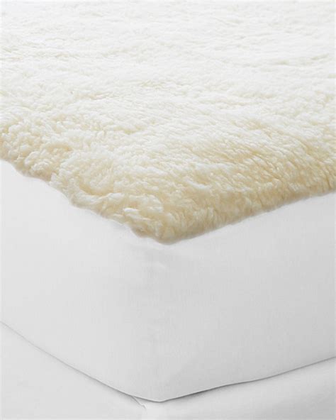 A wool mattress pad offers a thin cushion of comfort that elevates the cosiness of any bed, while also working to control body temperature. Wool Fleece Mattress Pad | Garnet Hill