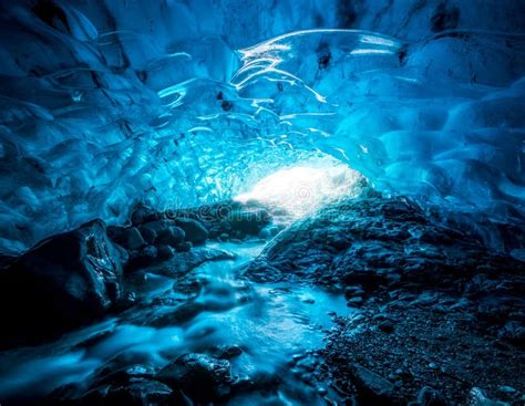 Entrance Of An Crystal Blue Ice Cave With Underground River Inside