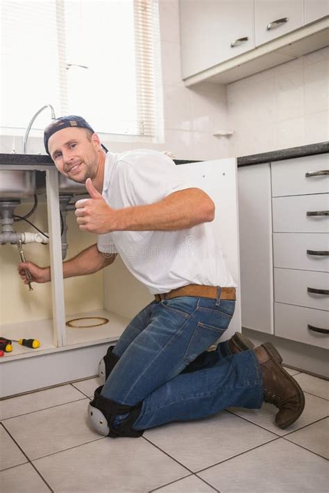 Plumber Fixing Under The Sink Stock Photo Image Of Professional Male