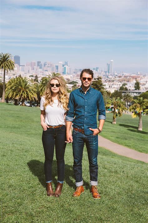Portrait Of Hipster Couple Standing In City Park By Trinette Reed