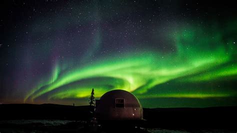 igloo under northern lights alaska shelly lighting