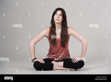 Woman Sitting Cross Legged Stock Photo Alamy