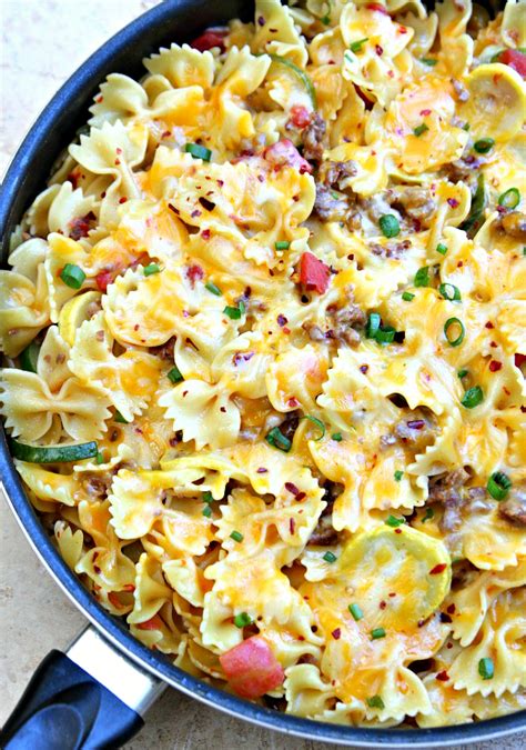 Cheesy pasta with sausage and brussels sprouts. One Pot Cheesy Sausage Pasta Skillet - Happy-Go-Lucky