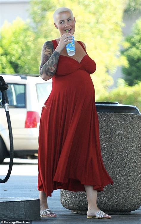 heavily pregnant amber rose positively beams while running errands with beau alexander edwards