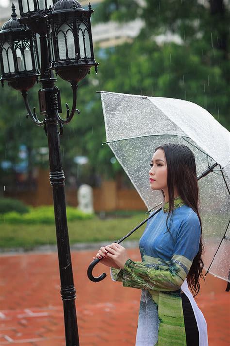 Vietnamese Women Wear Ao In The Rain Ao Dai Is Famous Traditional Custume For Woman In Vietnam