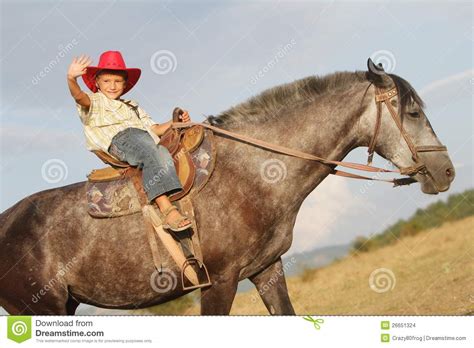 happy child boy riding horse  nature stock photo image  horse family