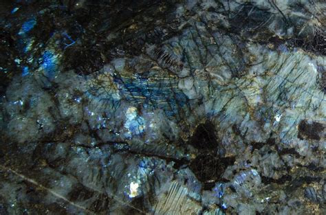 A Close Up View Of Some Rocks With Blue And Green Colors On Its Surface