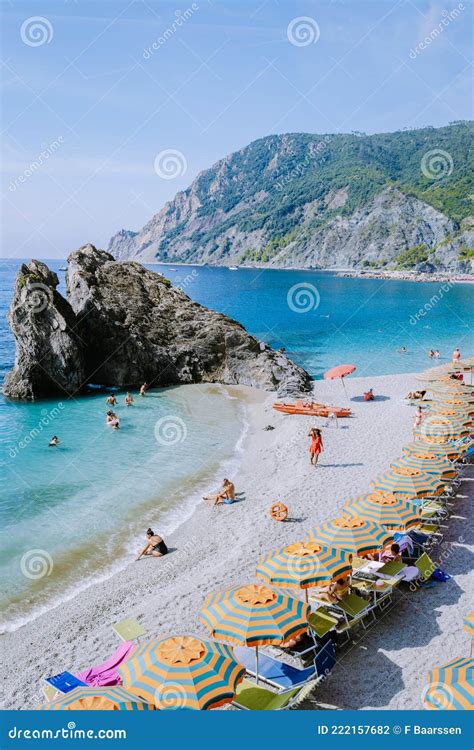 Chairs And Umbrellas Fill The Spiaggia Di Fegina Beach The Wide Sandy