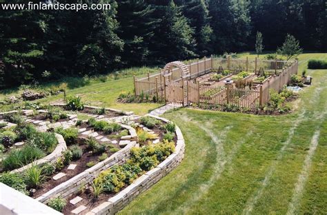 Country Garden Including A Terraced Herb Garden Fenced In Vegetable