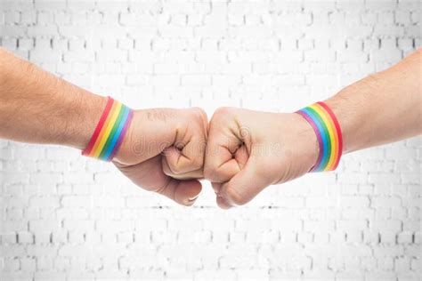 Hands With Gay Pride Wristbands Make Fist Bump Stock Image Image Of Adult Love 149883239